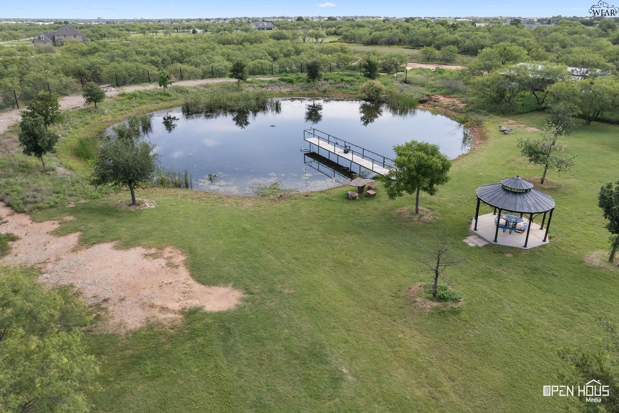 Aerial of pond and residence